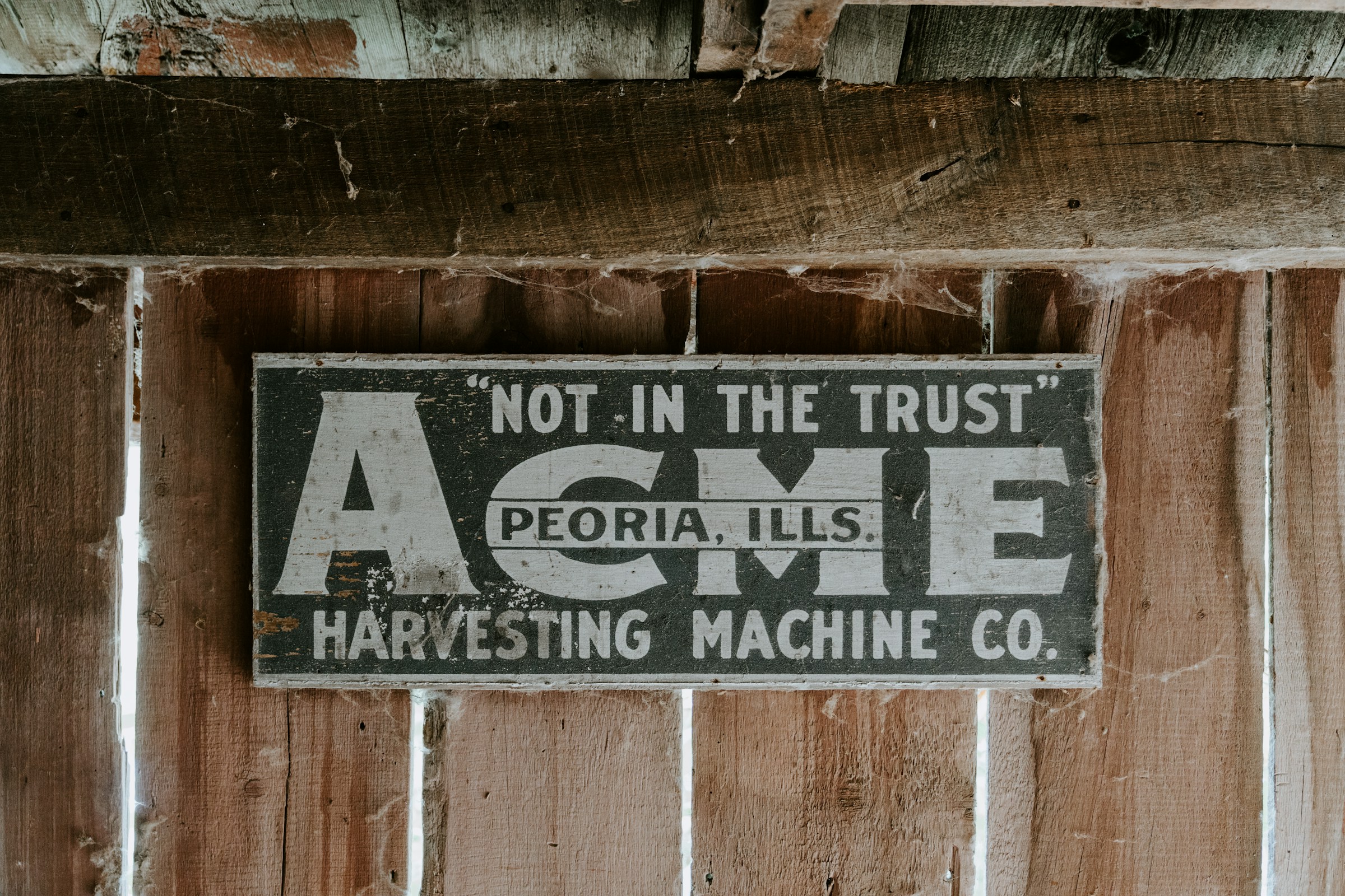 Vintage wooden signage on a heritage building.