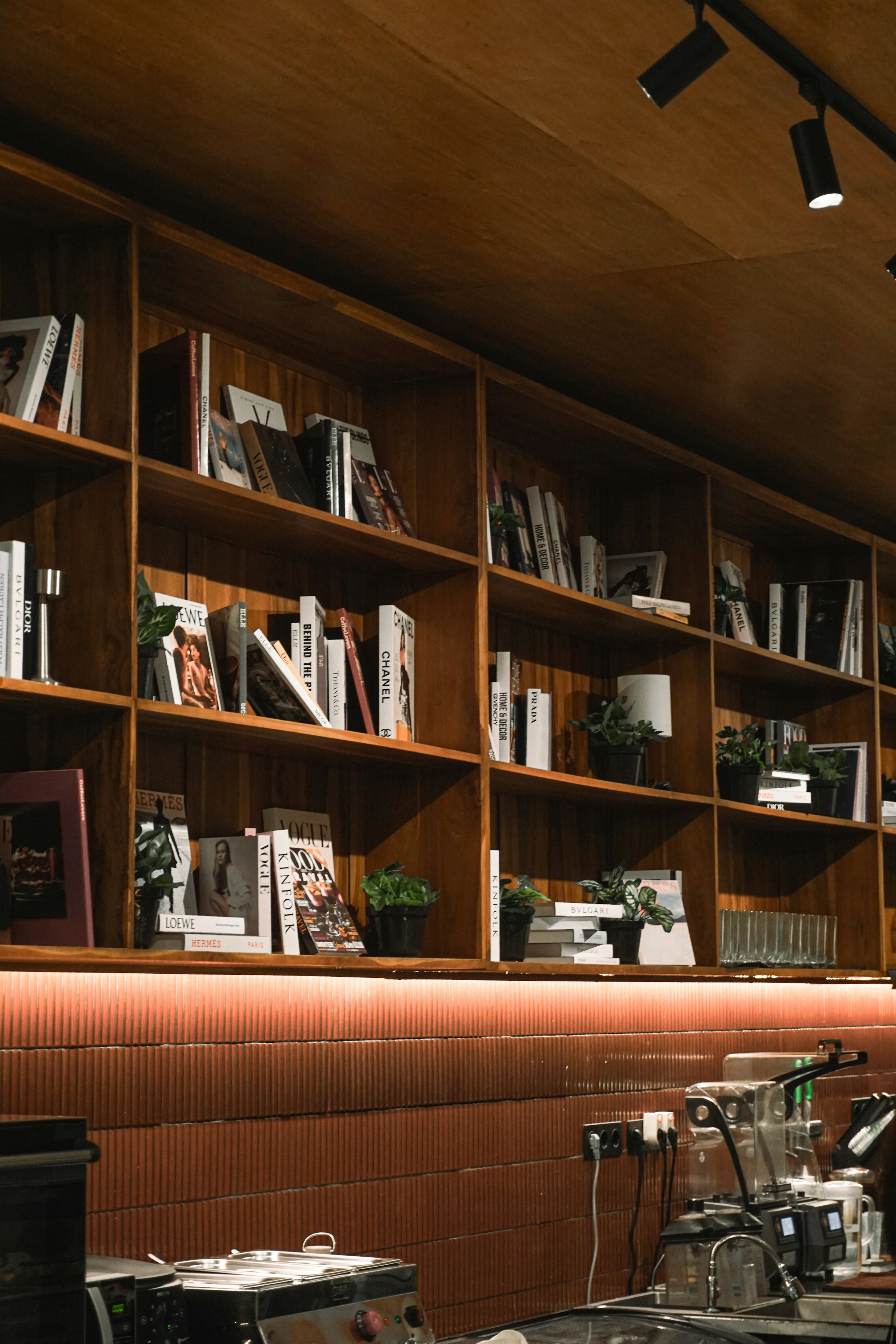 Warm office interior with wood bookshelves.